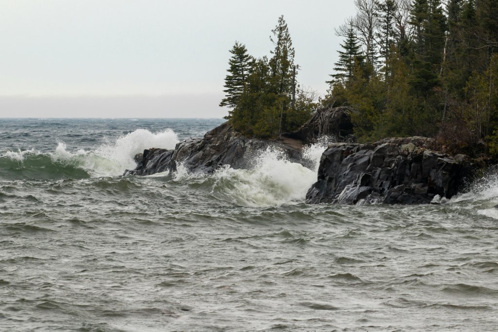 Water crashing on rocks on lake superior shore