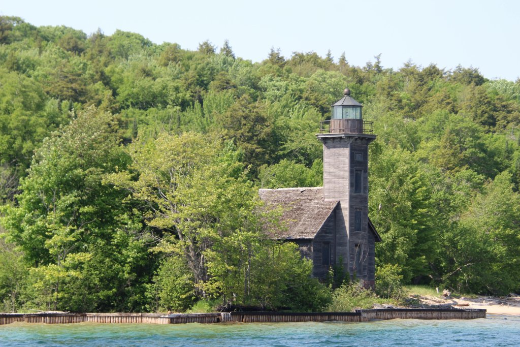 Traverse city lake with house on shoreline 